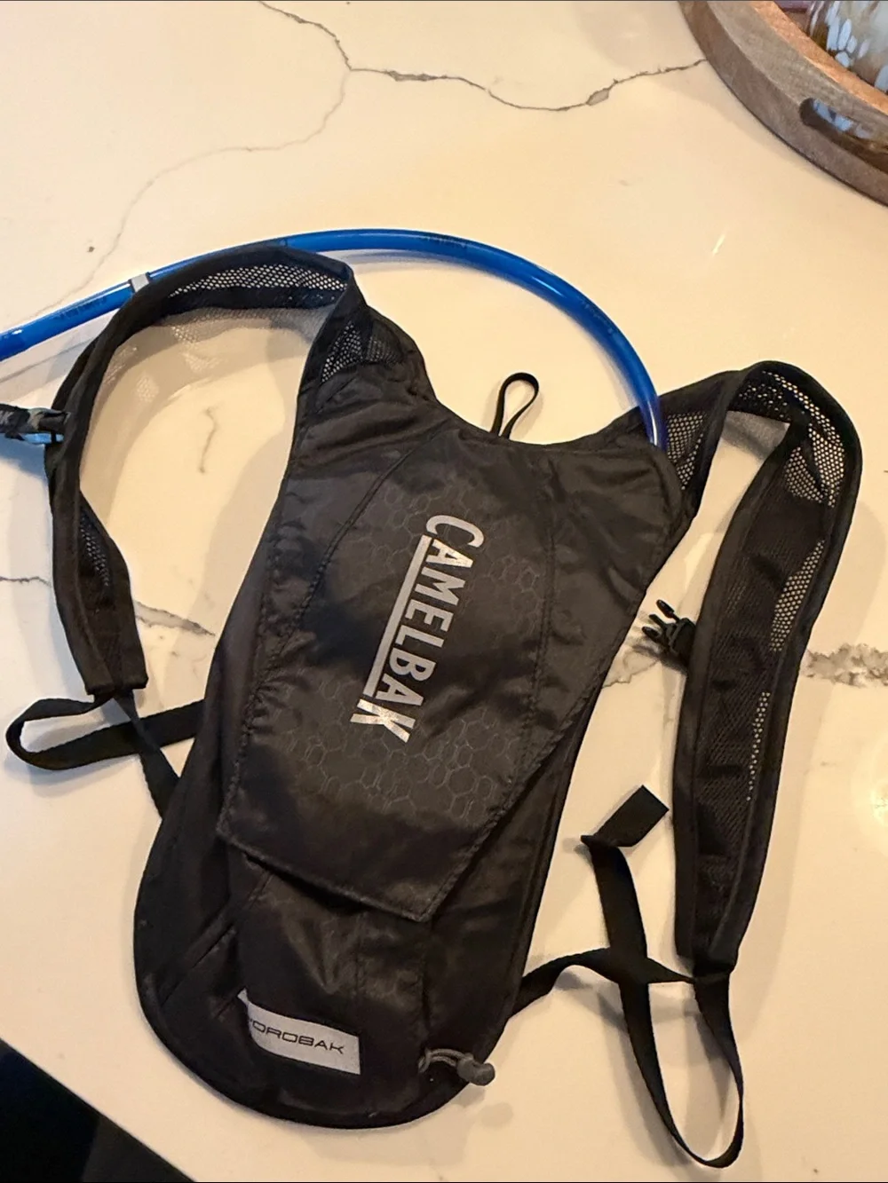 Camelbak Black Hydration Pack with Blue Drinking Tube